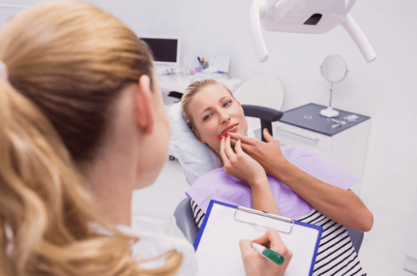 dental patient having an occlusal examination