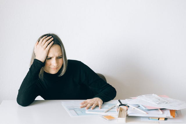 dentist-thinking-about-compensation-for-her-dental-employees