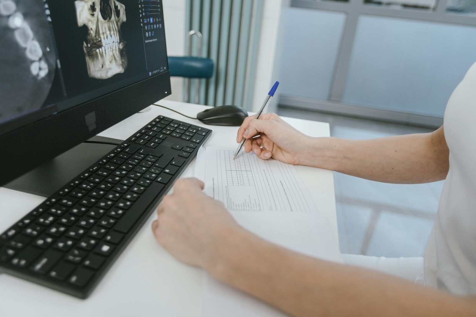 dentist-writing-treatment-letters-to-each-patient