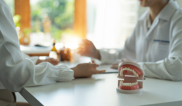 dentist and patient discussion about planned teeth treatment in